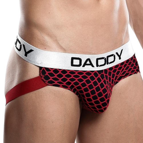 Someone sporting the Daddy Jockstrap in red and black, featuring a chic net design and a white waistband with DADDY, enjoys comfort from the functional pouch and contrast against the mesh fabric.