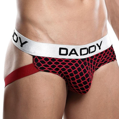 Someone sporting the Daddy Jockstrap in red and black, featuring a chic net design and a white waistband with DADDY, enjoys comfort from the functional pouch and contrast against the mesh fabric.