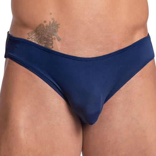 A person wearing a Daddy Wide Waistband Jockstrap in dark blue, revealing an abdomen tattoo.
