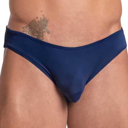 A person wearing a Daddy Wide Waistband Jockstrap in dark blue, revealing an abdomen tattoo.