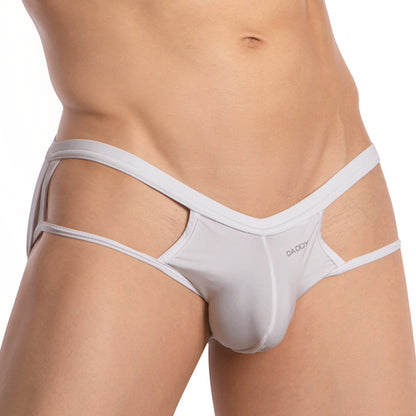 A person models the provocative design of Daddys Strapped Backless Jockstrap, flaunting its geometric pattern with snug fabric and side straps. The brand name on the waistband adds a sleek touch to this stylish underwear.