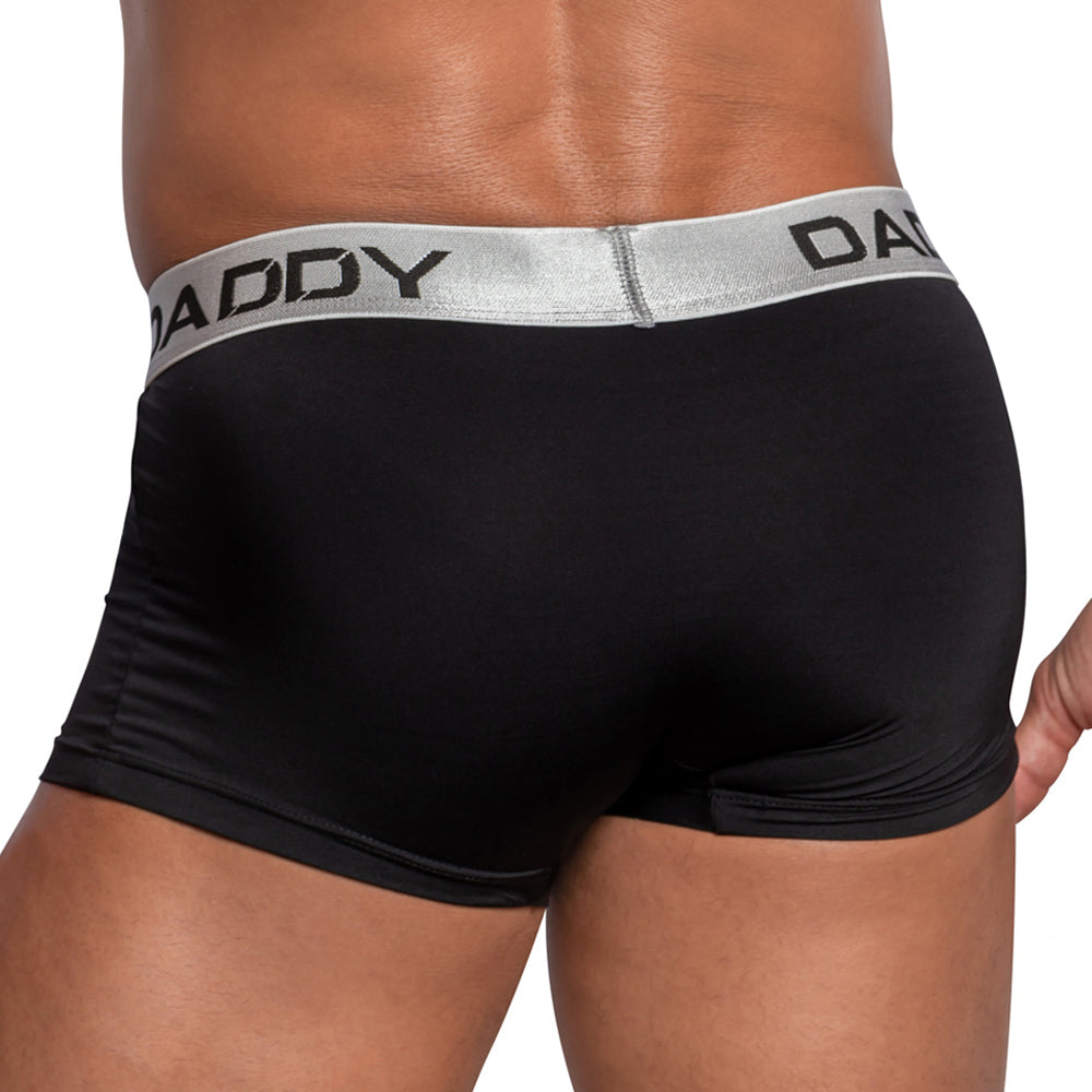 A person wears Daddys Criss-Cross Side Mesh Boxer, featuring a metallic waistband with DADDY printed on it. The image shows their back and waist, highlighting the sleek design and breathable mesh for ultimate comfort.