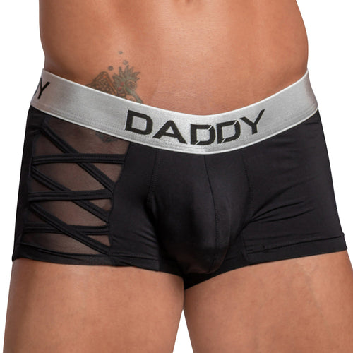 A person is wearing Daddy Criss-Cross Side Mesh Boxer briefs in black with a silver waistband labeled DADDY. Made from stretchy cotton, the design includes side mesh paneling. A tattoo gracefully peeks out above the waistband.