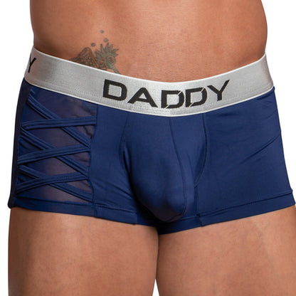 A person wears the Daddy Criss-Cross Side Mesh Boxer by Daddy, featuring blue color and a silver waistband displaying DADDY with stylish side mesh paneling.
