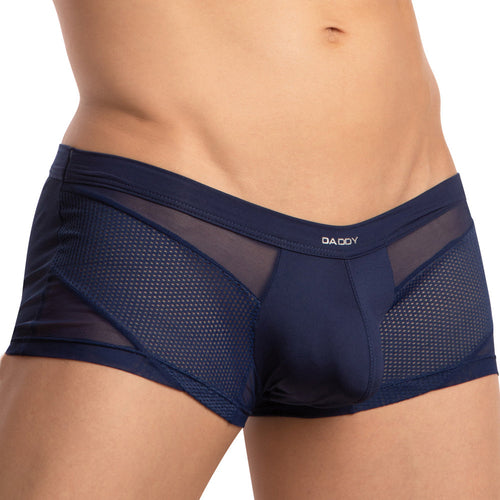 A person wearing Daddy Breathable Mesh Boxer Trunks in navy blue, featuring an intriguing mix of solid and fishnet fabric panels, paired with a branded waistband for a seductive vibe.