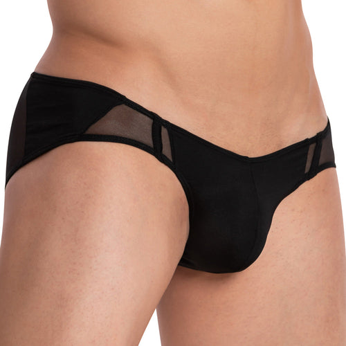 A person is wearing Daddy Equality Briefs with black briefs featuring sheer side panels. The image highlights the sleek design and perfect fit of the underwear, focusing on the hips and waist area.