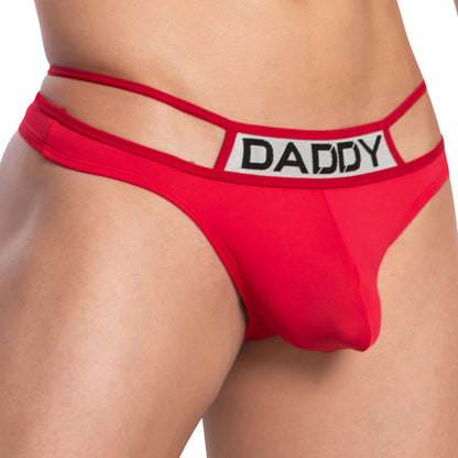 A person is wearing a red Daddy Pyramid Thong featuring a V-shape design, cut-out waistband with DADDY text, and a package-enhancing pouch for added flair.