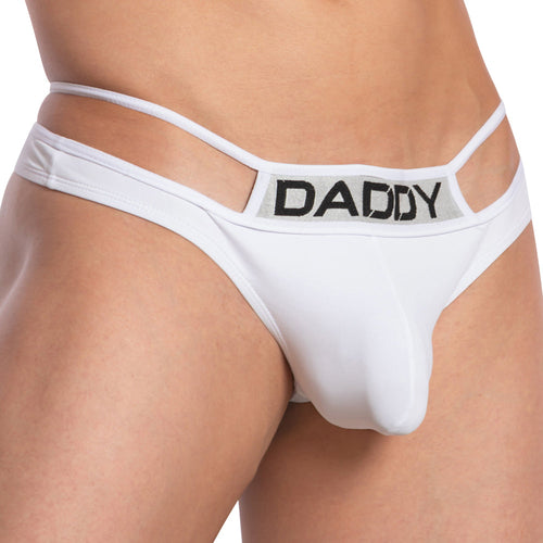 A person wearing the Daddy Pyramid Thong, featuring cut-out side straps and a package-enhancing pouch. The V-shape design includes a waistband with DADDY in bold black letters for an edgy touch.