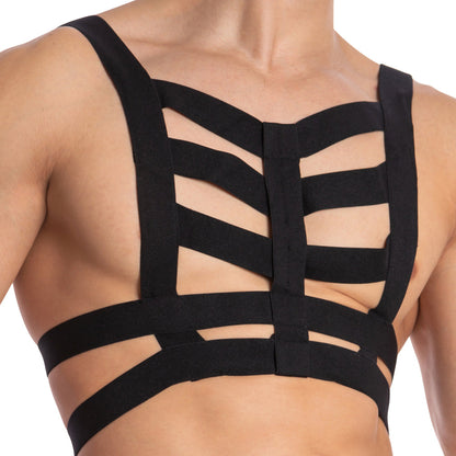 A person models the Daddy Hold On Hard Bodysuit, featuring a strappy black harness over a bare chest. Crafted from premium materials, it boasts intricate horizontal and vertical straps for superior support and an artistic pattern.