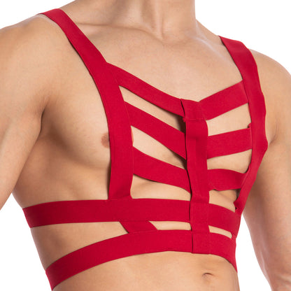 Someone is wearing a vibrant red Daddy Hold On Hard Bodysuit by Daddy, designed with premium fabric. This harness-inspired piece includes open chest and back panels, wide straps, and intricate cutouts for superior support and a bold look.