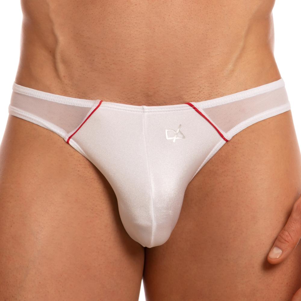 A model wears the Daniel Alexander Free Panels Bikini, featuring white briefs with red accents and mesh sides. Crafted from a polyamide-spandex blend, it is adorned with a subtle logo. The background is plain white.