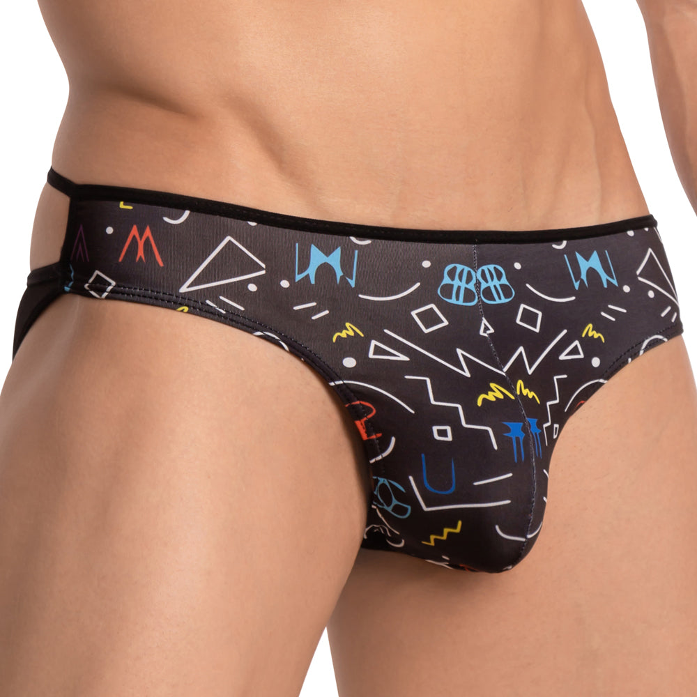 A person models the bold Daniel Alexander DAI071 Monster Bikini, featuring sheer black fabric adorned with colorful geometric and abstract patterns such as shapes and numbers, focusing on the torso and waist while keeping the face hidden.