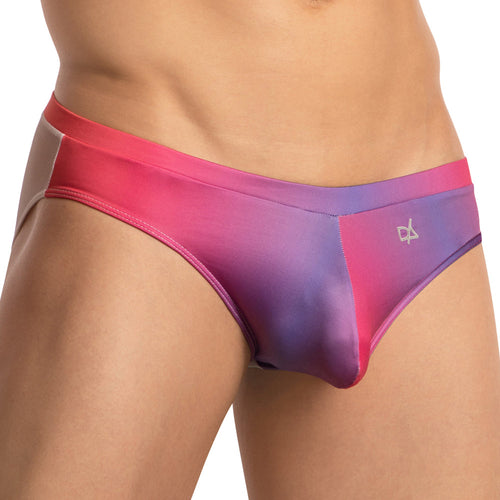 A person flaunts the Daniel Alexander Color Slash Bikini, boasting a vibrant gradient of pink, purple, and blue. These men’s swim briefs ensure a perfect fit with a subtle logo against a plain white background.