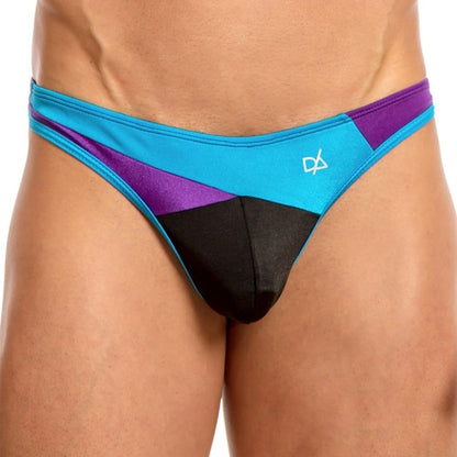 A person is wearing a Daniel Alexander Slash Thong, featuring an enhancing pouch and sleek blue, purple, and black panels with a small logo. The background is plain white.