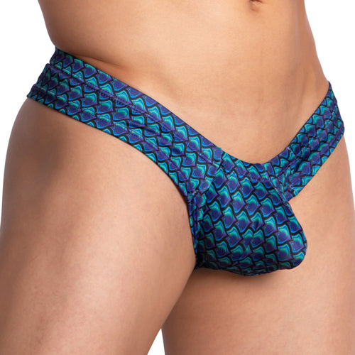 Close-up of a person wearing Daniel Alexander Glare Thong featuring blue and green patterns, with a V-shaped pouch. The side and front views show swimwear crafted from breathable polyamide-spandex blend by brand Daniel Alexander.