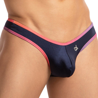 Someone is wearing a Daniel Alexander Rainbow Sides Thong, featuring a shiny, dark design with pink and purple trim. A small logo adorns the side. The plain background highlights the vibrant and comfortable style of these briefs from Daniel Alexander.