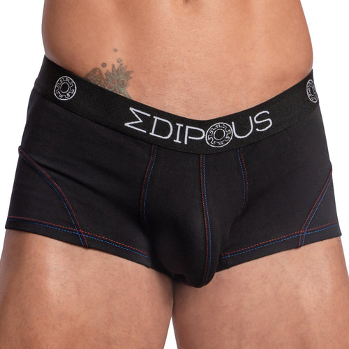 Someone is wearing Edipous Bi-Color Sports Boxer Trunks, featuring blue and red stitching with a branded EDIPOUS waistband. The supportive pouch offers comfort, and a tattoo is partly visible on the persons lower abdomen.