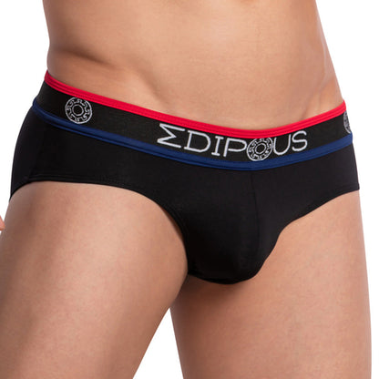 A person is wearing an Edipous Munich Brief, a low-rise mens bikini with black briefs and a red-blue waistband, showcasing the Edipous brand name and logo for stylish flair and luxurious comfort.