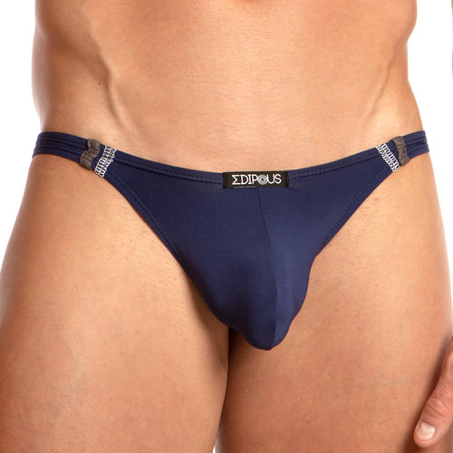 The image features the Edipous Soft Thong by Edipous, a navy blue swimsuit brief with a front logo design, made from ultra-soft fabric. It includes double side straps for a snug fit while showing the torso but not the face.