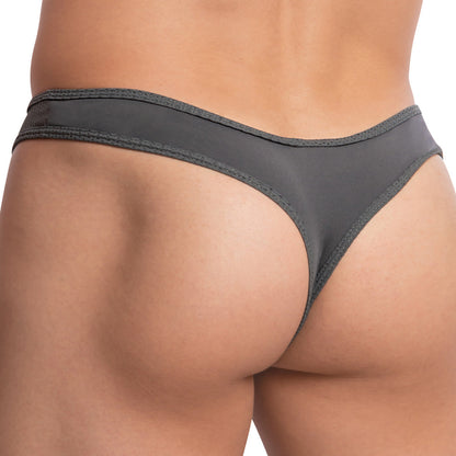 A close-up displays a person wearing the Edipous Maximilian Thong by Edipous in dark gray, featuring a low-rise fit and V-shaped back design. The smooth fabric with slight sheen highlights subtle waistband stitching, emphasizing the stylish cut from the back.
