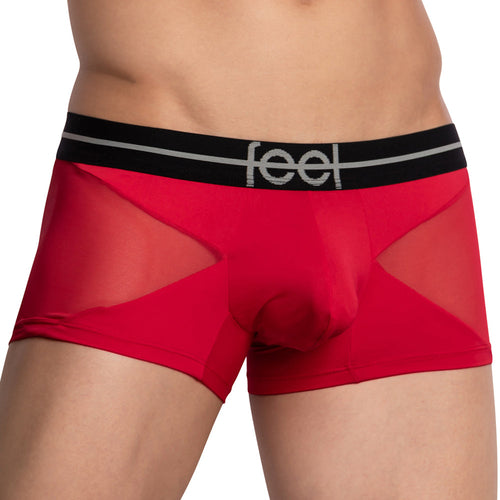A close-up shows a person wearing the Feel Lustrous Sports Boxer Trunk in red and black, with feel in gray on the waistband. Designed with mesh panels for style, it includes a supportive pouch made from stretchy cotton for comfort.