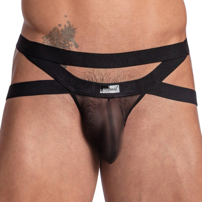 A person wears the daring Good Devil Jockstraps Criss-Cross Straps, featuring a bold black mesh design with double waistband straps. The sheer fabric fits snugly, highlighting a supportive pouch and revealing part of a side tattoo.