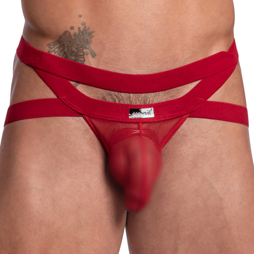 A person wearing Good Devil Jockstraps Criss-Cross Straps in red, featuring a supportive pouch, with a tattoo visible on their upper abdomen.