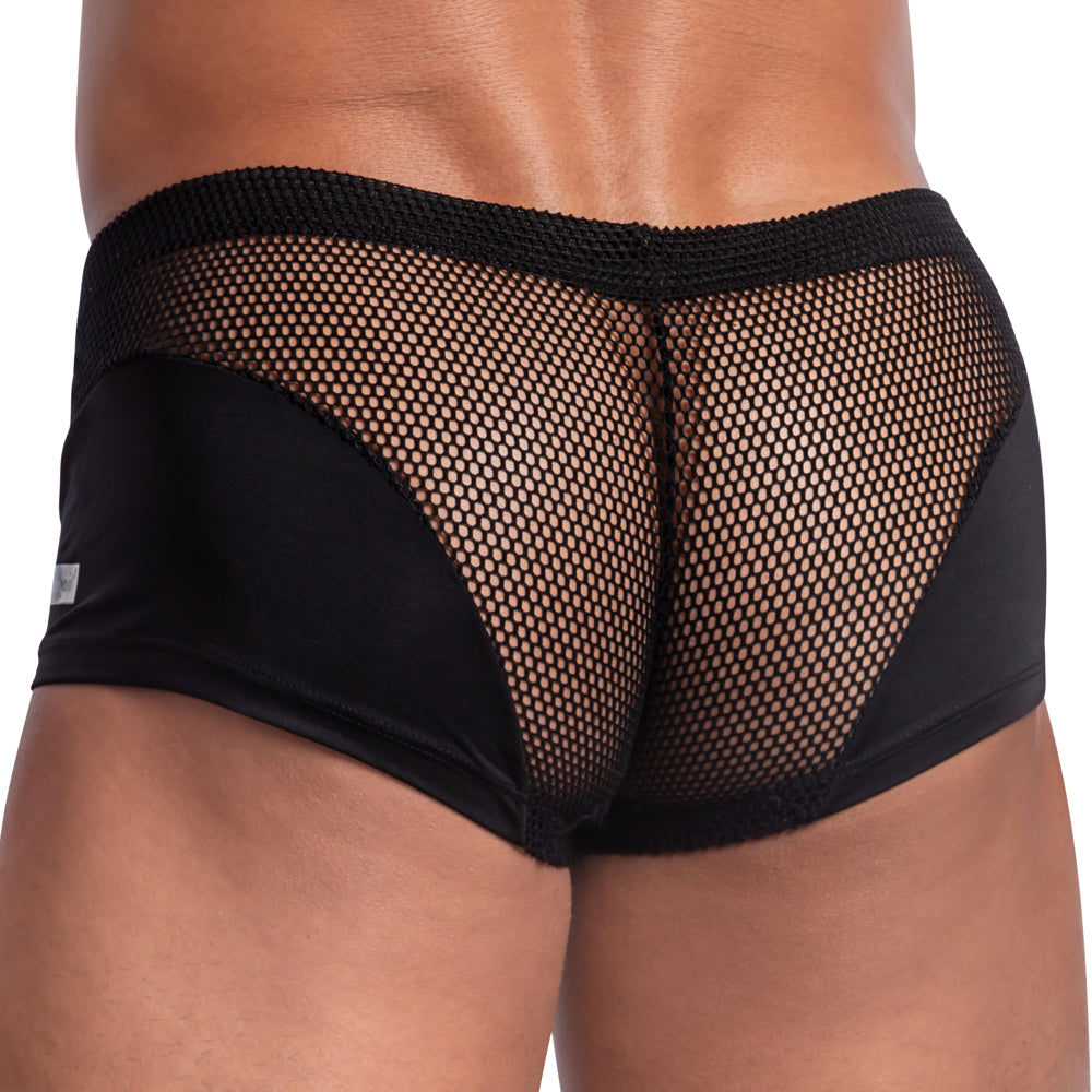 A person wearing Good Devil Boxer Almost Naked underwear with solid fabric sides. This design has minimal coverage and offers a breathable mesh back for an enticing see-through effect.