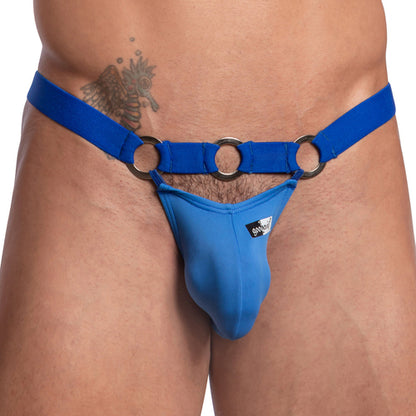 A person is wearing the Good Devil Bikinis Steel Ring Waistband by Good Devil, a minimalist blue harness jockstrap featuring silver rings that partially expose their torso.
