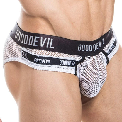 A person wearing Good Devil Show It All Briefs with a black waistband adorned with the GOOD DEVIL text is viewed from the side, emphasizing the see-through net-like texture and supportive pouch fit.