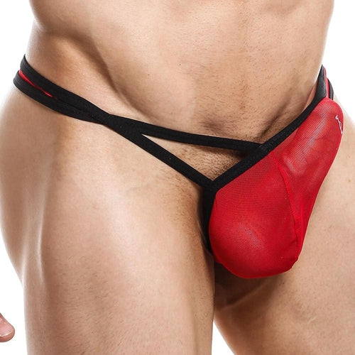 A person wearing a Good Devil Thong highlights its supportive design, with bold black straps and a semi-sheer red pouch that accentuates the midsection, showcasing the eye-catching design and perfect fit of this striking Good Devil underwear.