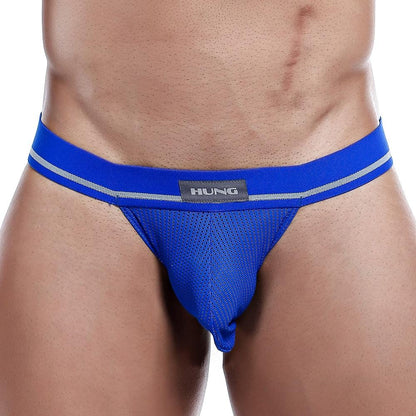 A person wearing the Hung Jockstrap by Hung, featuring a sporty blue design with HUNG on the waistband, contrasting stripes, and a breathable mesh pouch for comfort.