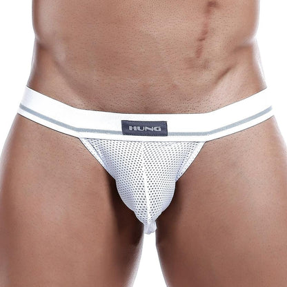A person wears the Hung Jockstrap, featuring white mesh underwear with a wide elastic waistband and Hung branding on the front, emphasizing the breathable mesh pouch and midsection.