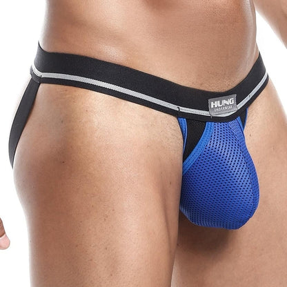 A person showcases the Hung Expose Jockstrap, featuring a sexy design with an innovative blue and black mesh waistband and a wide black band.