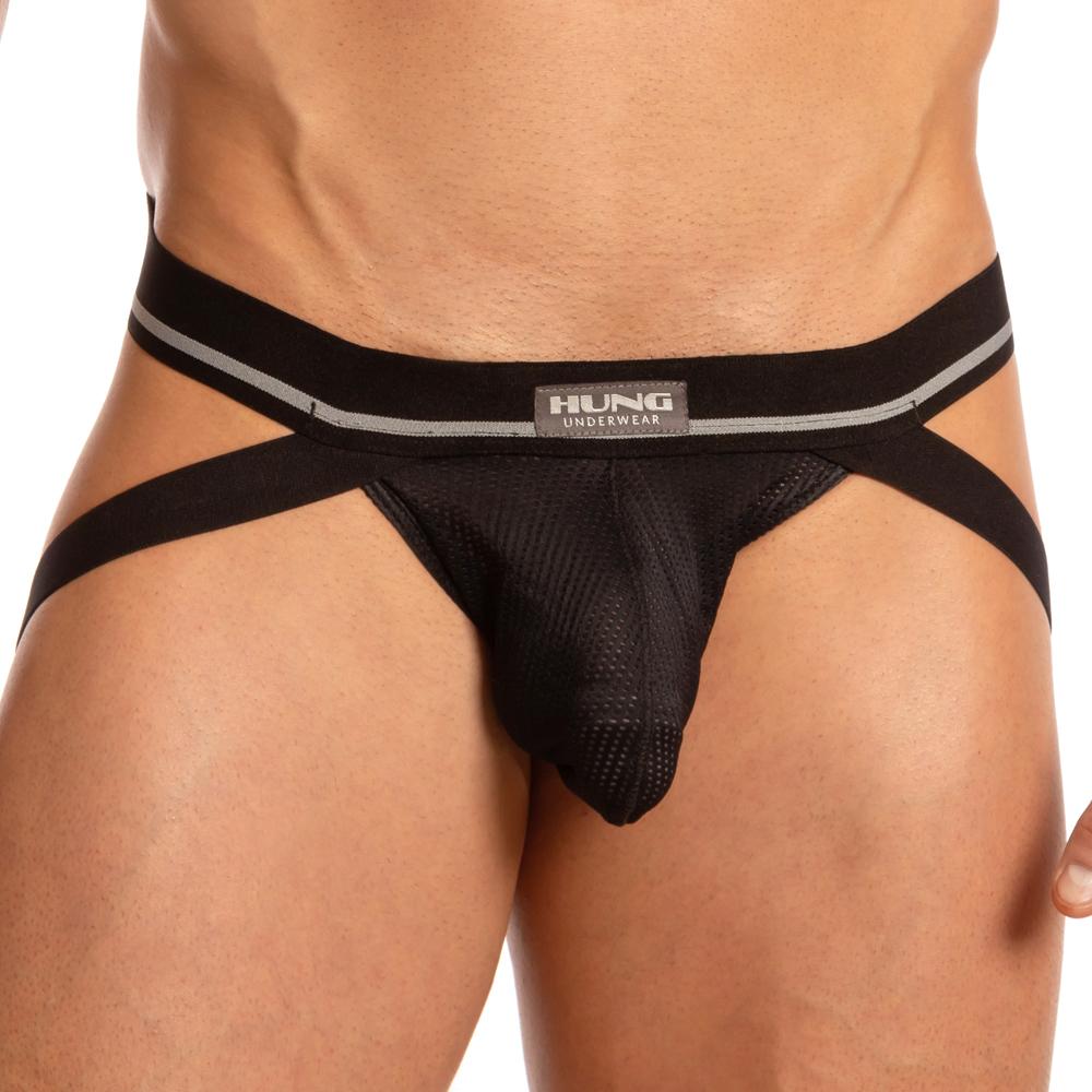 Someone is wearing the Hung Big Boy Jock in black mesh, featuring a supportive pouch and a black and gray waistband with the Hung logo, highlighting the midsection.