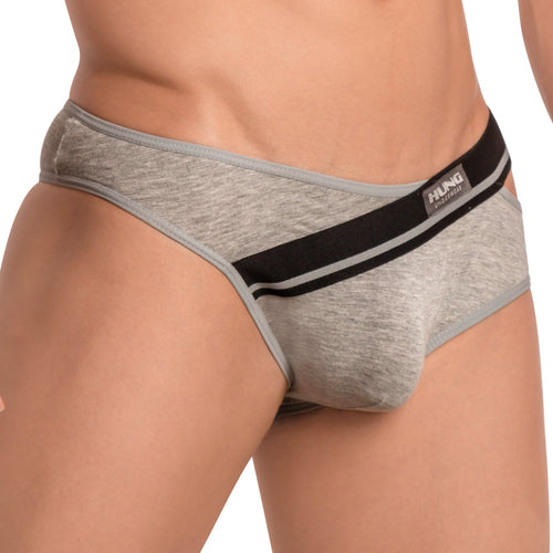 A person wears the gray Hung Ivan Brief from Hung, showcasing a stylish, form-fitting cut with black and white waistband details. The brand name is prominently displayed, accentuating its butt-enhancing design for added appeal.