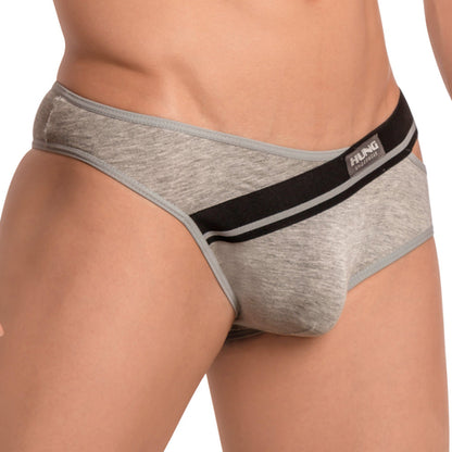 A person wears the gray Hung Ivan Brief from Hung, showcasing a stylish, form-fitting cut with black and white waistband details. The brand name is prominently displayed, accentuating its butt-enhancing design for added appeal.