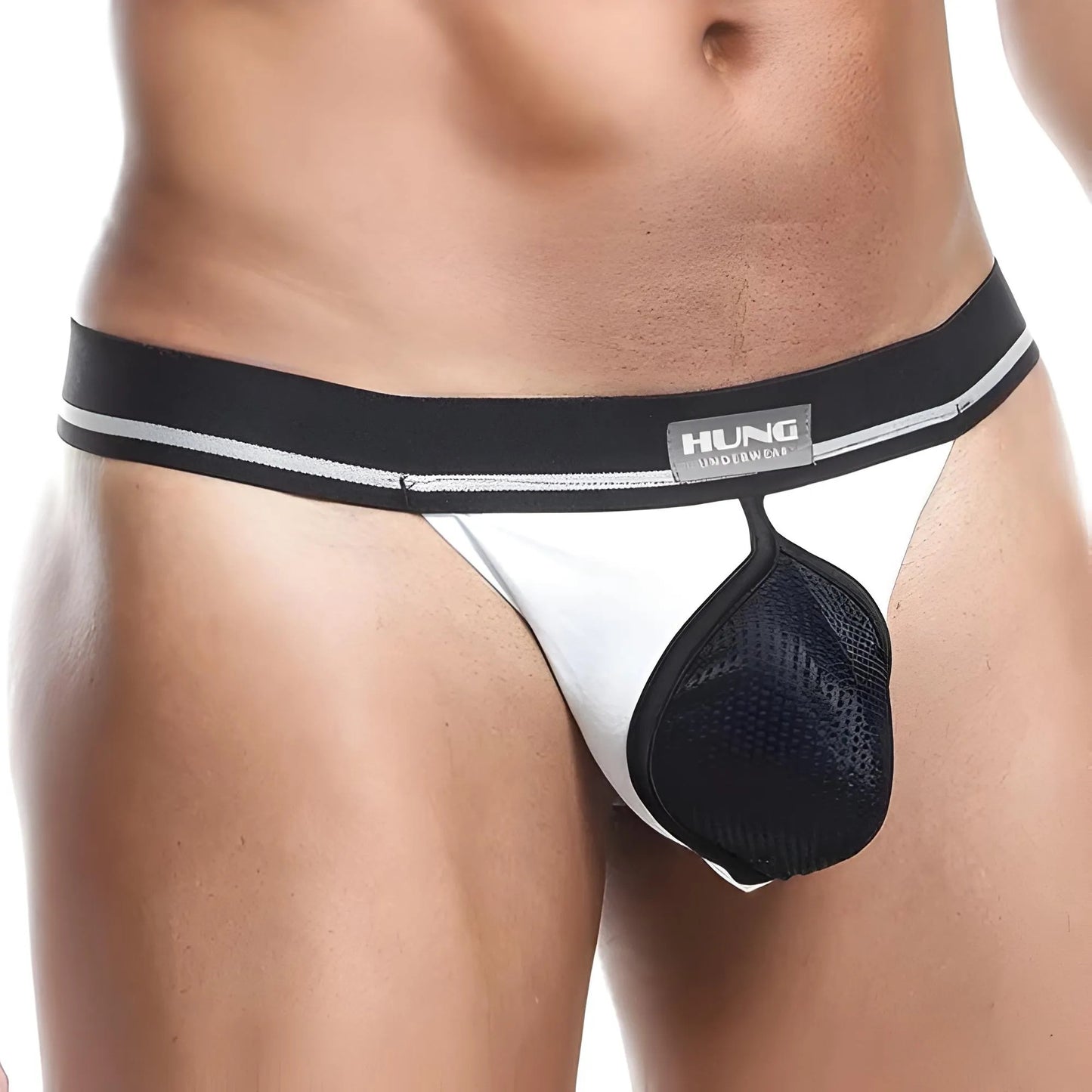 A man wearing the Hung Zoom Pouch, featuring a black and white design with a branded Hung waistband, stands against a plain background. The premium fabric blend highlights the design and fit of this mens underwear.