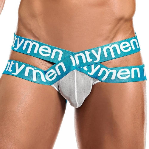 A person wearing Intymen Cross Jockstraps flaunts a bold, predominantly white design with unique blue cross straps showcasing the intymen brand name in white letters, highlighting the lower torso area.