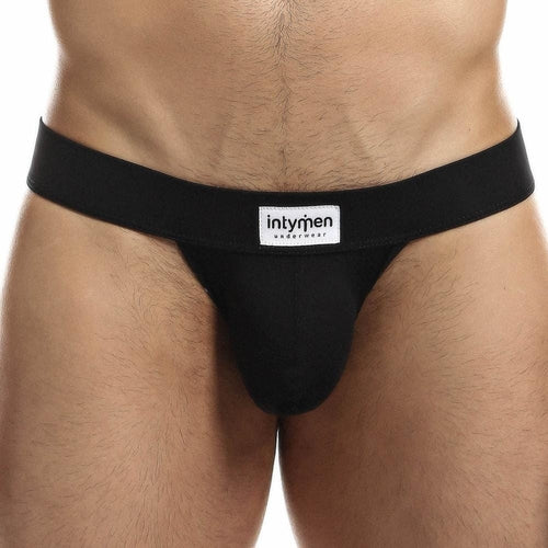 A person wearing Intymen Proud Jock is shown from waist to upper thighs. The jock has a broad waistband displaying Intymen, providing a supportive fit and contoured pouch for comfort.