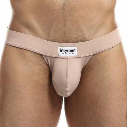 A close-up featuring the Intymen Proud Jock shows the contoured pouch for support and a waistband with Intymen branding, emphasizing comfort and style against a plain white background.