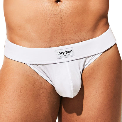 Close-up of a man wearing the Intymen Loving Jockstrap, featuring a supportive thick waistband with an Intymen logo. The cotton-spandex blend highlights its sleek design and perfect fit.