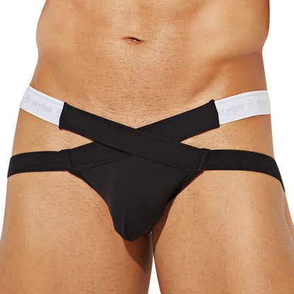 A person is wearing an Intymen black Cross Strapped Jockstrap with a wide waistband, featuring the brand Intymen. The image spotlights the seductive design and stretchy fit around the midsection.