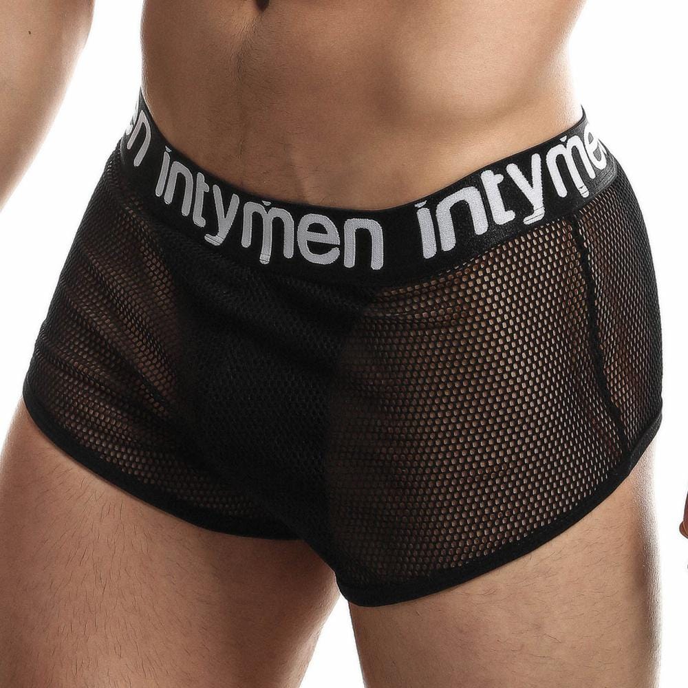 Someone sports the Intymen Jock Mesh Cover, featuring black mesh briefs with a supportive fit, see-through design, and a white waistband emblazoned with intymen across the lower torso and upper thighs.