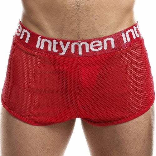 A person wearing Intymen Jock Mesh Cover, featuring breathable red mesh fabric for a snug, supportive fit. The image highlights the front view from waist to mid-thigh, showcasing the Intymen band on the waistband.