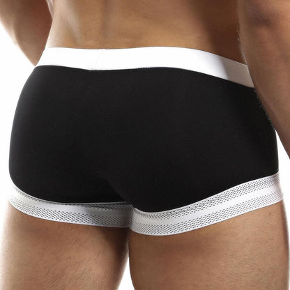 A person sports Intymen Quads Trunk, highlighting a tailored fit with a white waistband and dotted trim at the leg openings in black and white. Crafted from premium fabric, these boxer briefs offer ultimate comfort and style.