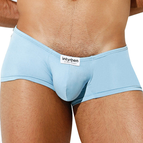 A person wears light blue Intymen Di Blu Boxer Trunk with a visible brand label on the waistband, highlighting the lower torso and thighs for all-day comfort against a plain white background.