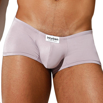 Someone is wearing light-colored, fitted Intymen Di Blu Boxer Trunks featuring a supportive pouch and a visible intymen label on the waistband, perfect for all-day comfort.