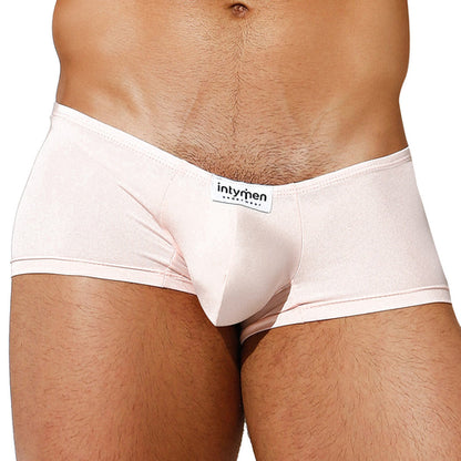 A close-up shows a person in light pink Intymen Di Blu Boxer Trunk, crafted for all-day comfort. The waistband displays the intymen label, and the supportive pouch accentuates the midsections contour from waist to upper thighs against tanned skin.
