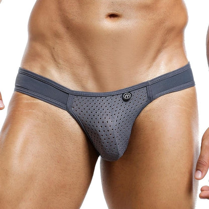 A person wearing gray Intymen Bikini briefs by Intymen showcases their lower torso. The focus is on the fit and design, featuring breathable mesh fabric for comfort.